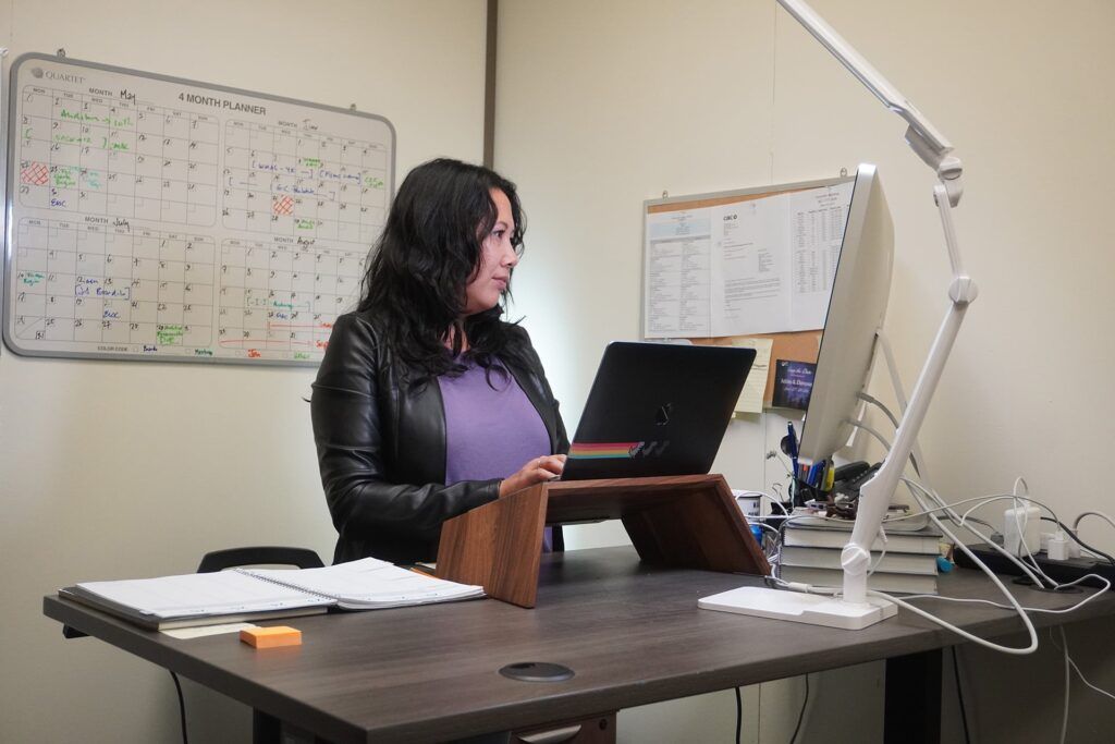 An employee works at her desk
